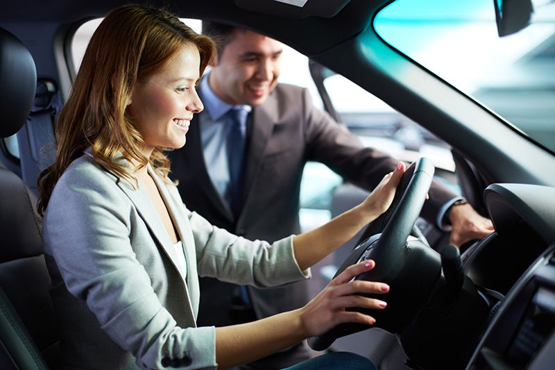 Mercedes-Benz of Smithtown sales professional assisting a customer