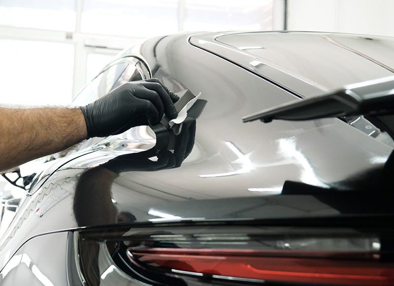 Illustration of a car being washed and cleaned